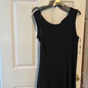 Black pucker material dress with a bow back